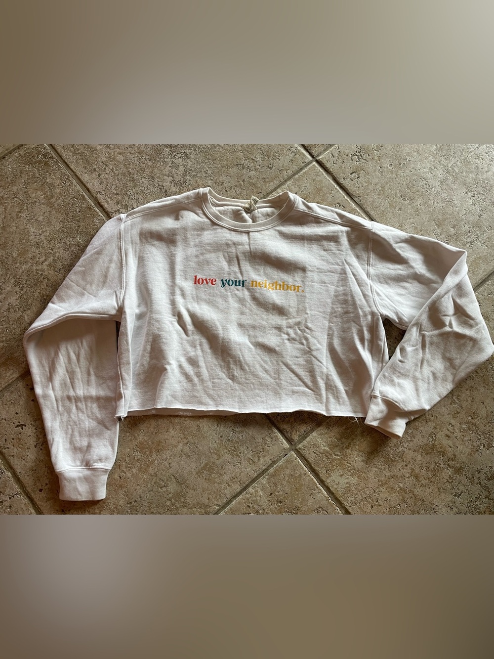 White Cropped Sweatshirt with Multicolor 'love your neighbor.' Text